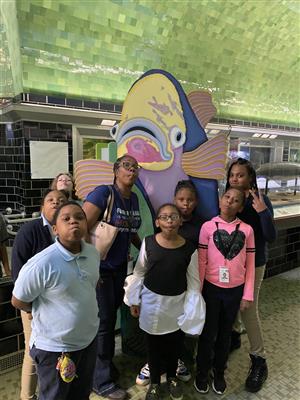 teacher and students with fish clip art at Belle Isle Aquarium 